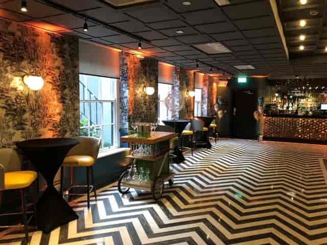 Elle's Suite at Iveagh Garden Hotel: modern decor for intimate gatherings and networking events.