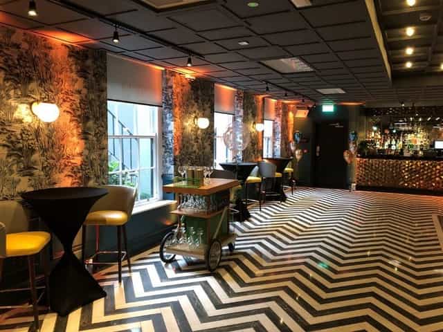 Elle's Suite at Iveagh Garden Hotel: modern decor for intimate gatherings and networking events.
