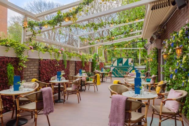 Bar at Iveagh Garden Hotel: elegant outdoor space with glass roof, ideal for social events.