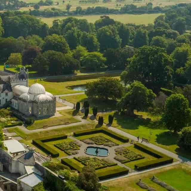 Killruddery House gardens: lush greenery, serene pond, ideal for weddings and events.