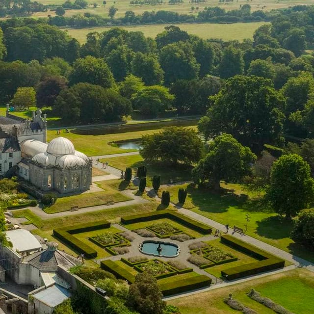 Killruddery House gardens: lush greenery, serene pond, ideal for weddings and events.