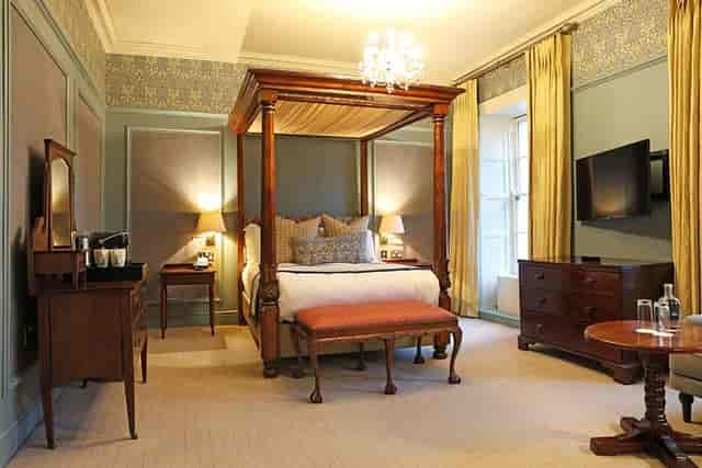 Luxurious Garden Suite with four-poster bed for corporate retreats at Barberstown Castle.
