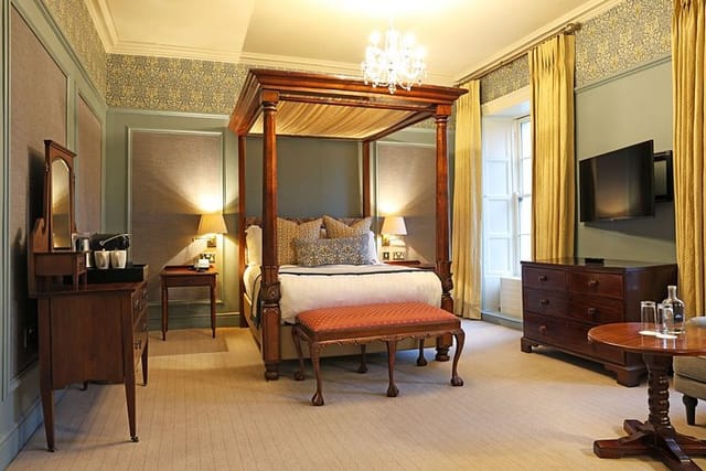Luxurious Garden Suite with four-poster bed for corporate retreats at Barberstown Castle.