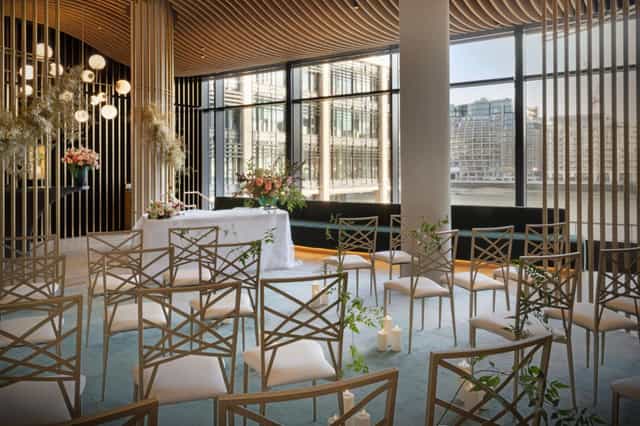 Elegant wedding venue in The Westin Hamburg with floral centerpieces and natural light.