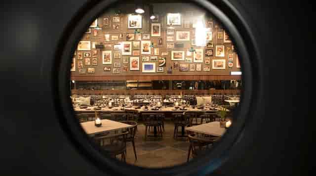 Kitchens Restaurant at Pierdrei Hotel, Hamburg - elegant event space with circular window.