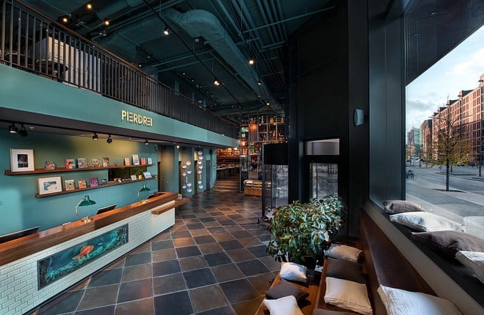 Modern event space in RACKER ROOM, PIERDREI Hotel HafenCity, perfect for meetings and networking.