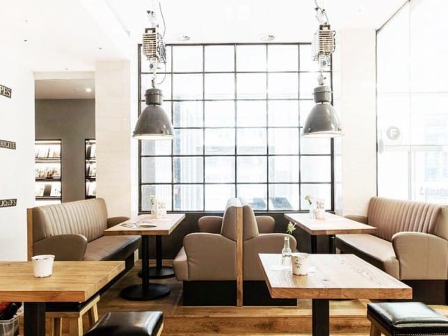 Modern café with booth seating, perfect for casual meetings and events.