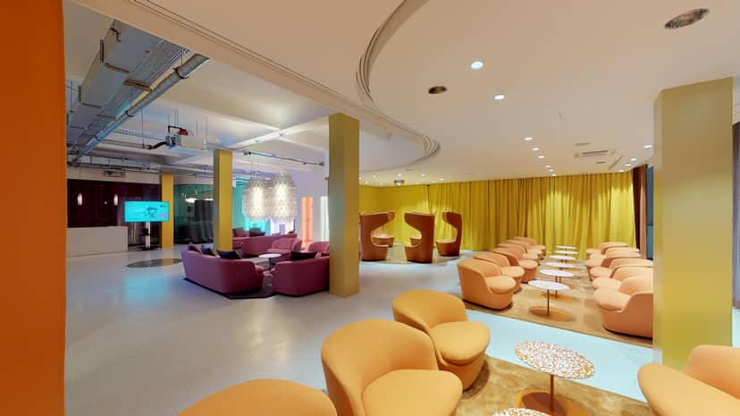 Cappellini Lounge modern meeting space with vibrant decor, perfect for events and networking.