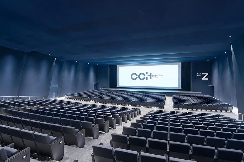 Modern auditorium for hybrid conference, product launch.