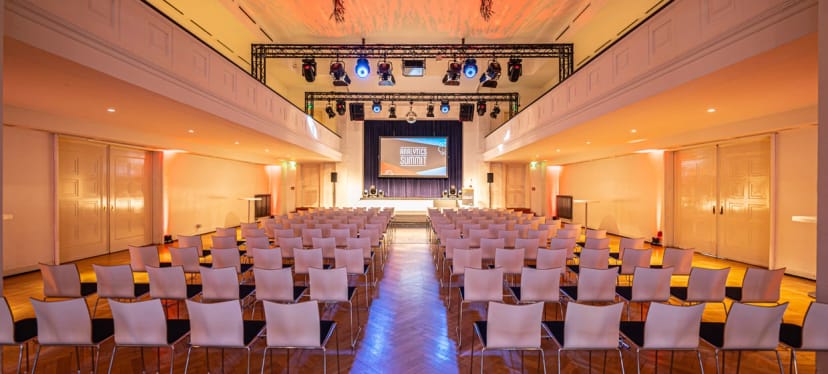 Conference stage, tiered seating, event space, Curio-Haus