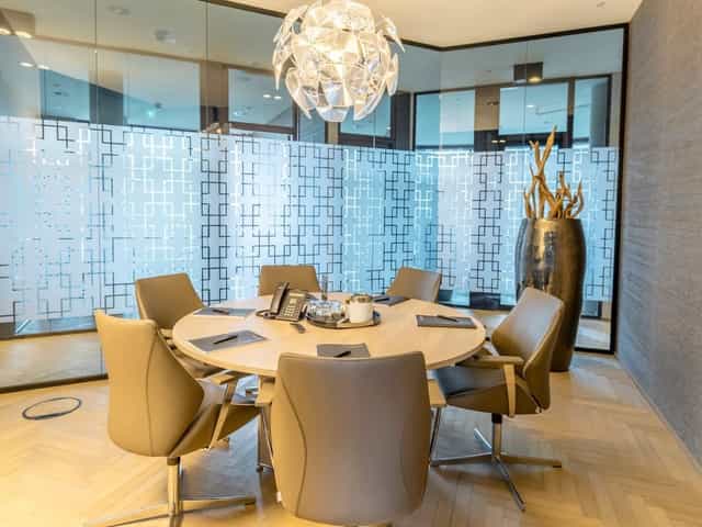 Modern boardroom, circular table, business meeting, networking event