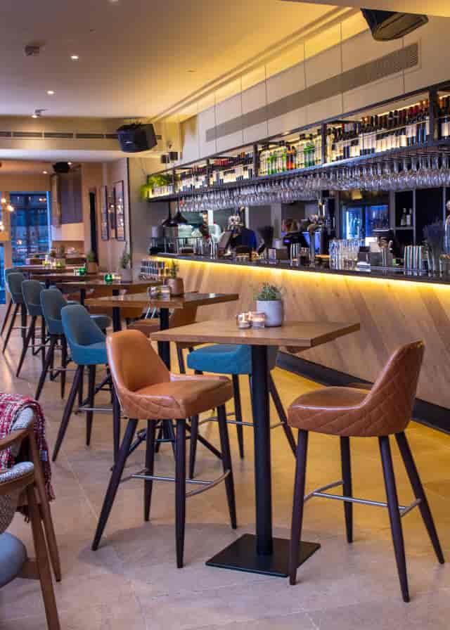 Stylish bar area in The Otherist, ideal for networking events and casual meetings.