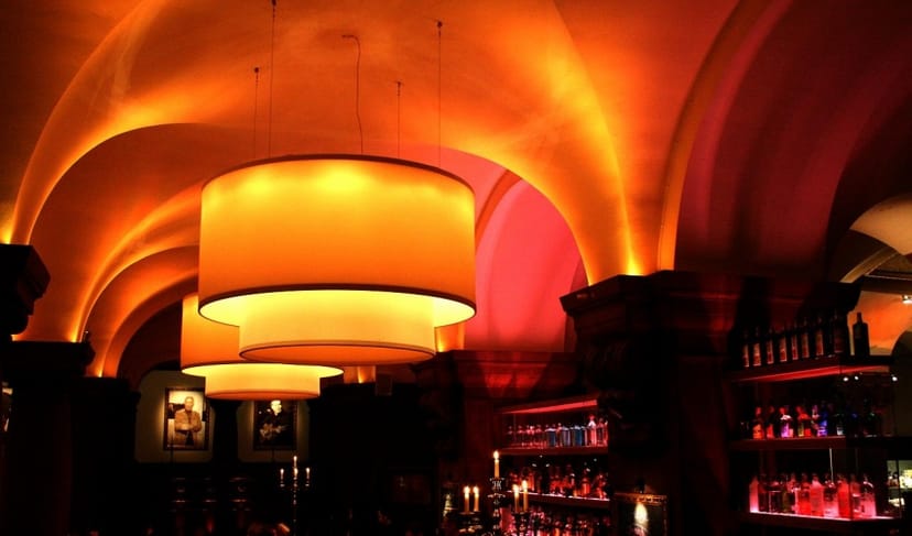 Parliament Private Dining: Elegant archways, ambient lighting, cocktail, event.