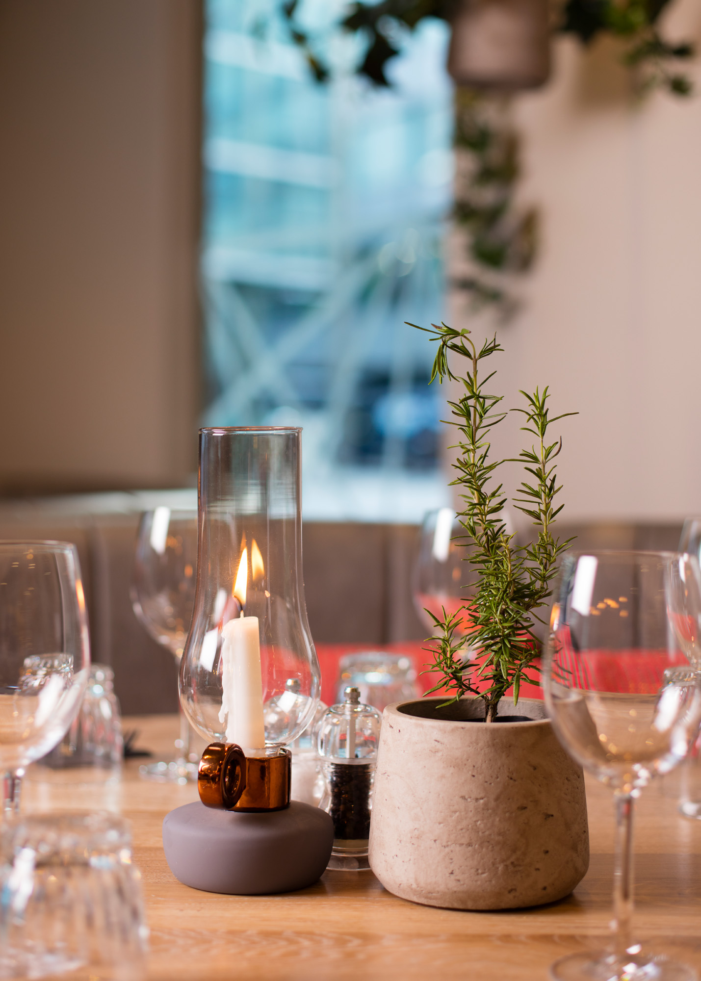 Elegant dining table with rosemary centerpiece for intimate upscale event at The Otherist. - Banner