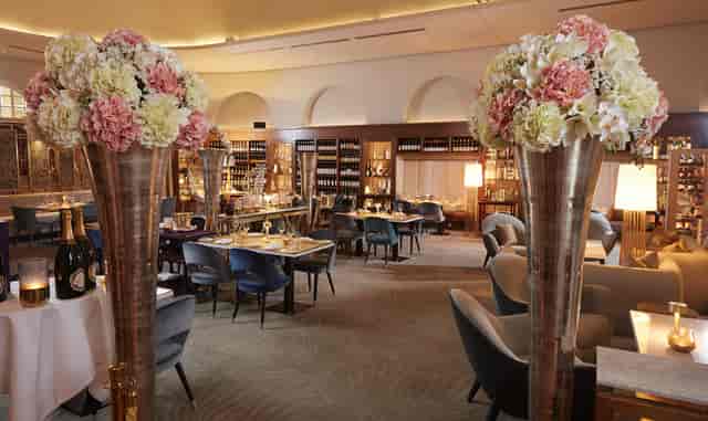 Elegant dining room, floral centerpiece, corporate event, upscale lunch