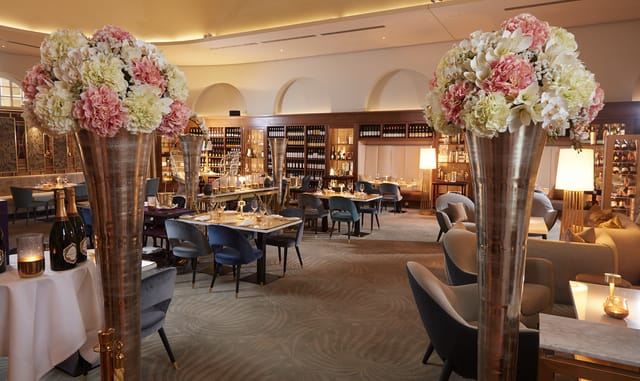 Elegant dining room, floral centerpiece, corporate event, upscale lunch