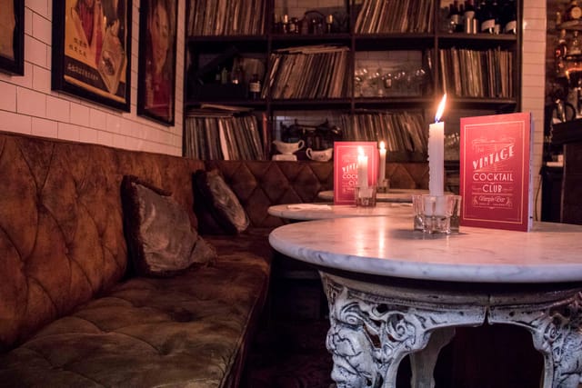 Vintage cocktail bar, velvet seating, party event, launch celebration