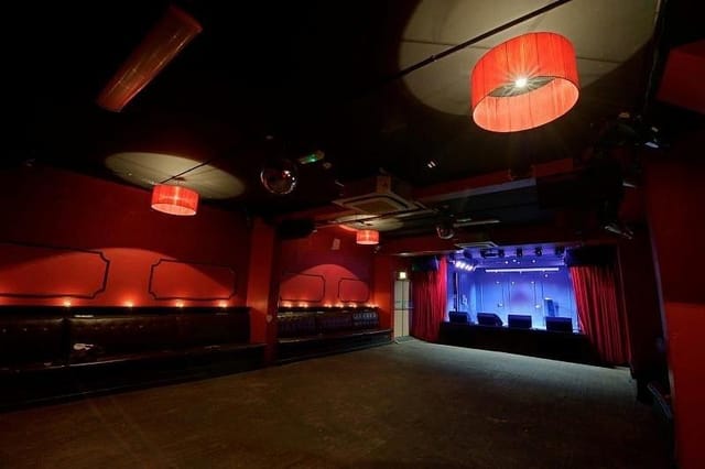 Workmans Club bar stage, red light, event venue, live music
