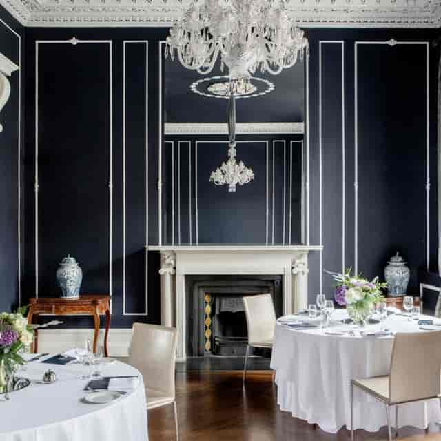 Elegant conference center with chandelier, ideal for corporate meetings and events.