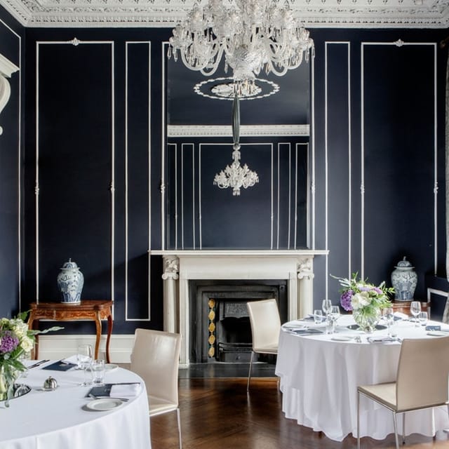 Elegant conference center with chandelier, ideal for corporate meetings and events.