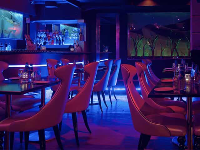 Chic club lounge, modern, cocktails, networking.