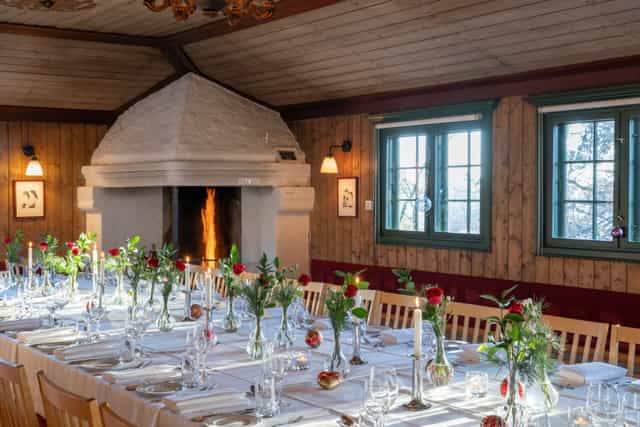 Rustic folk museum dining event, fireplace ambiance