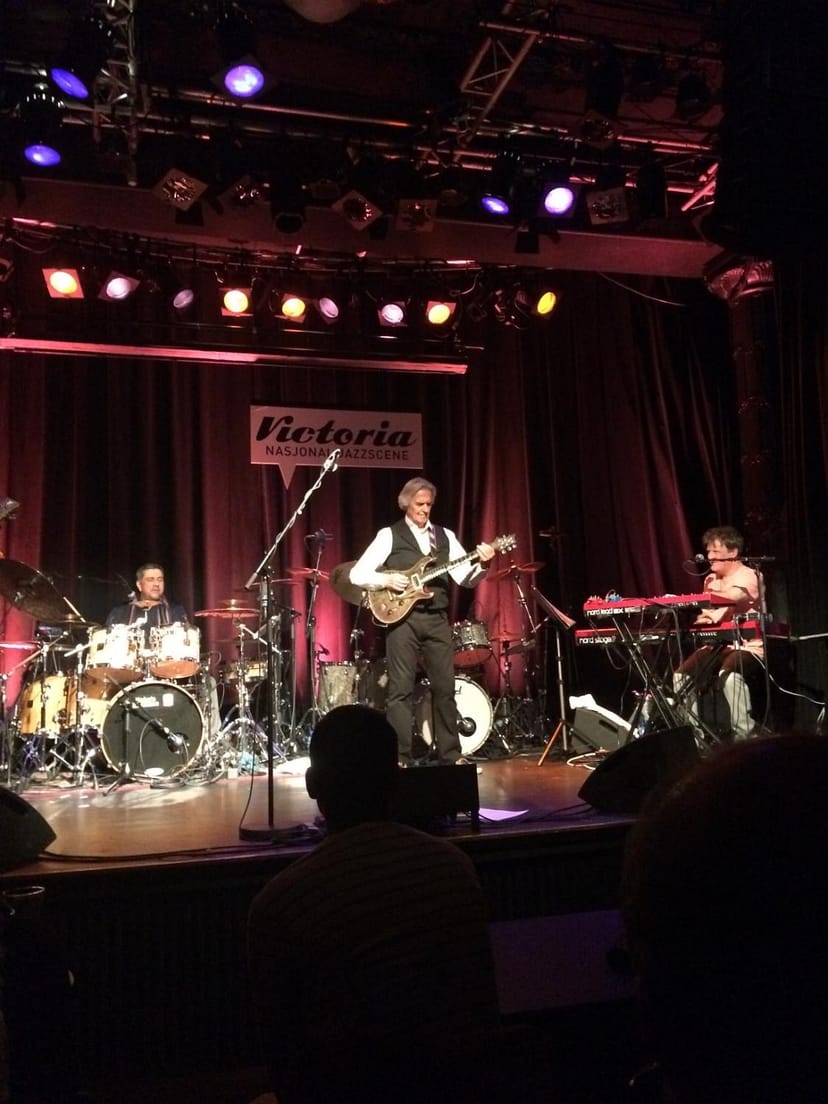 Jazz concert stage, red curtains, live music event
