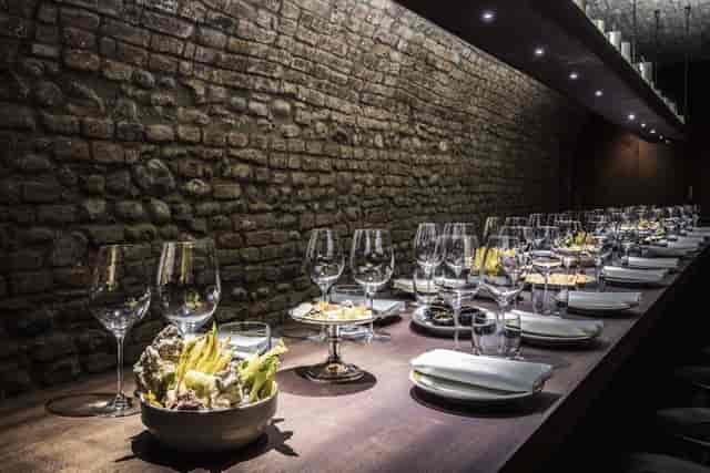Del Cambio wine cellar, rustic table, corporate dinner, private tasting.