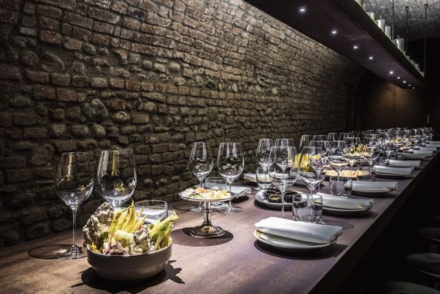 Del Cambio wine cellar, rustic table, corporate dinner, private tasting.