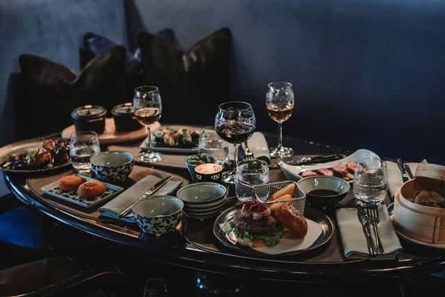 Elegant catering setup, VIP lounge, executive dinner, sushi, burgers