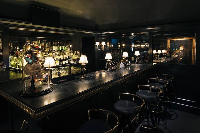 Intimate Cavour cocktail bar, moody lighting, corporate reception, VIP lounge.