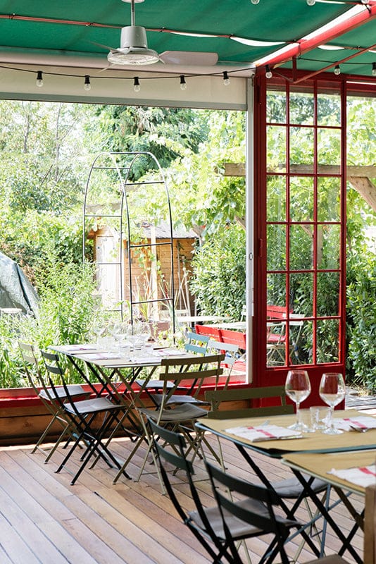 Erba Brusca garden restaurant event. Rustic outdoor dining.