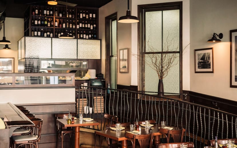 Riccardo Trattoria: elegant dining, wine display, corporate dinner, client entertainment