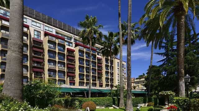 Luxury hotel venue, palm trees, conference, event