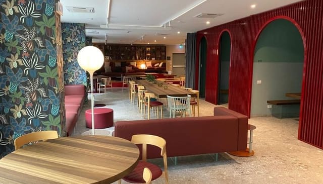 Modern hotel meeting room, flexible seating, networking, breakout event