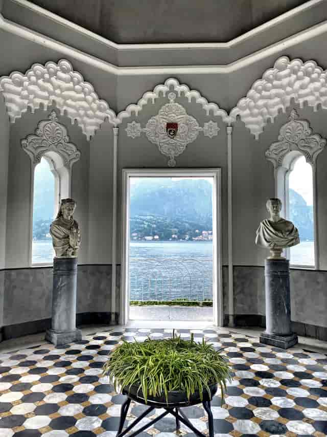 Elegant villa gardens event, historical venue, water view.