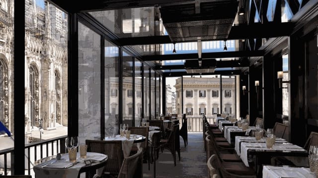 Rooftop restaurant Da Giacomo Arengario, elegant city views, corporate dinner, product launch.