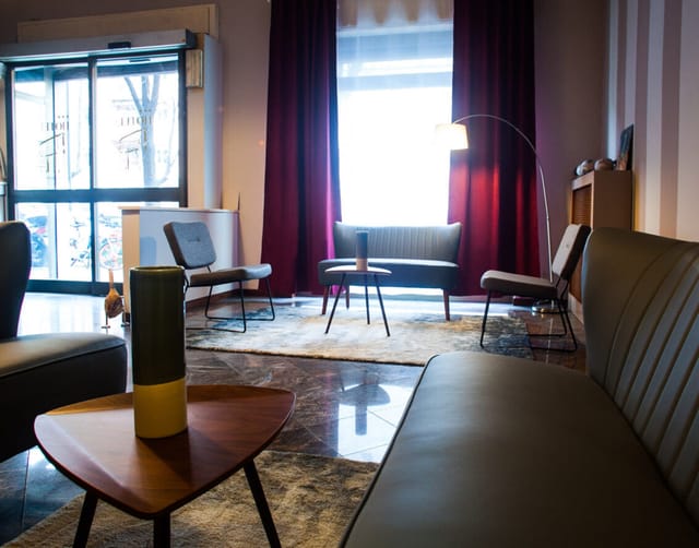 Hotel Porta Romana modern lounge, purple curtains, event networking