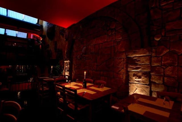 Rustic stone private dining room, red lighting, event
