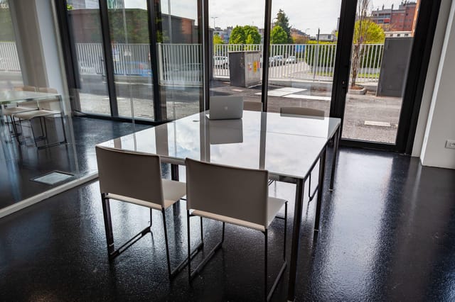 Minimalist meeting room, natural light, executive briefing, client consultation