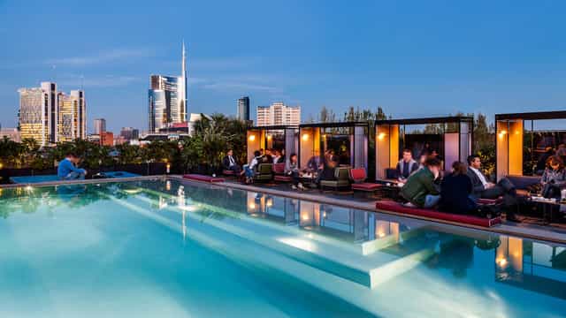 Rooftop bar, city view, cocktail reception, product launch