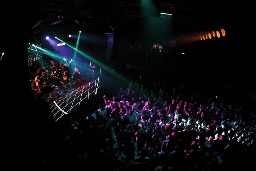 Magazzini Generali concert crowd, vibrant lights, dance event