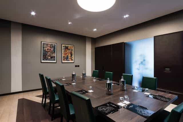 Hotel Monopole boardroom meeting, green chairs