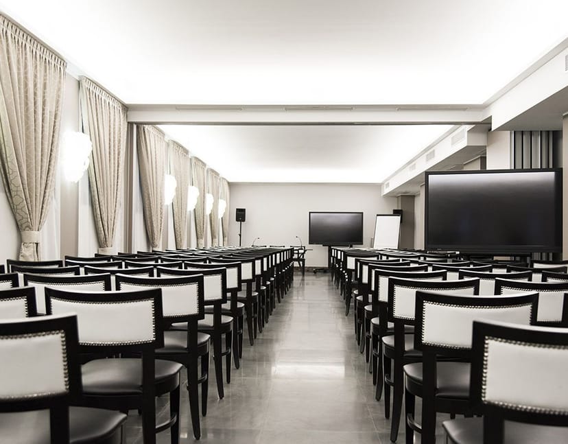 Fornasetti Meeting Room at Bianca Maria Palace Hotel, elegant decor for corporate events.