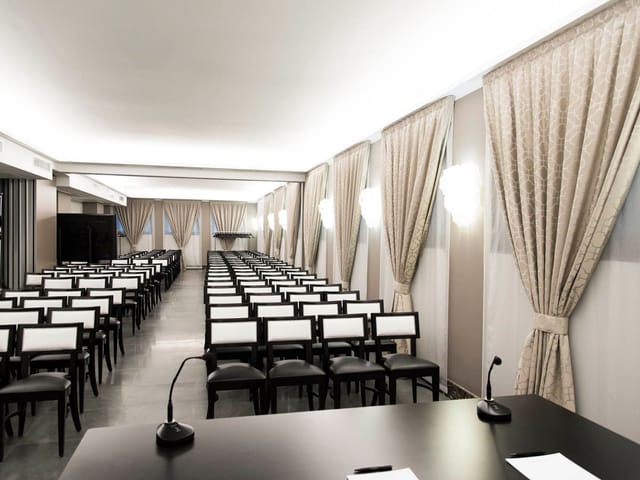 Fornasetti Meeting Room at Bianca Maria Palace Hotel, elegant setup for conferences.