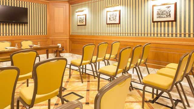 Sforza Meeting Room at Hotel Manzoni with elegant wooden paneling for professional events.