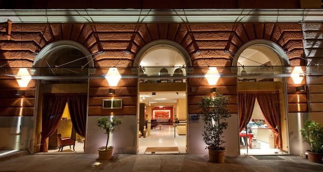 Elegant hotel entrance with arched doorways, perfect for conferences and events.