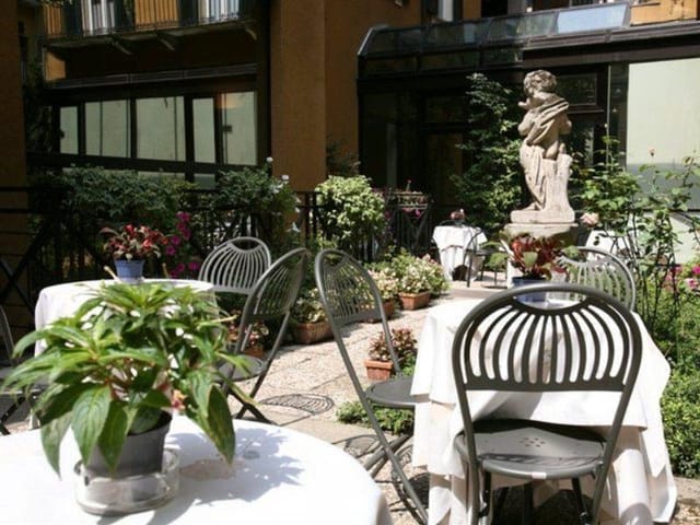 Inviting outdoor terrace at Hotel Sanpi Milano, perfect for intimate events and receptions.