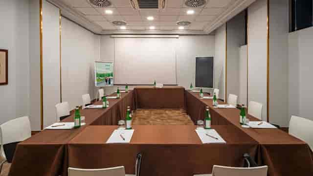 Function room at UNAHOTELS Galles Milano, U-shaped setup for professional events.