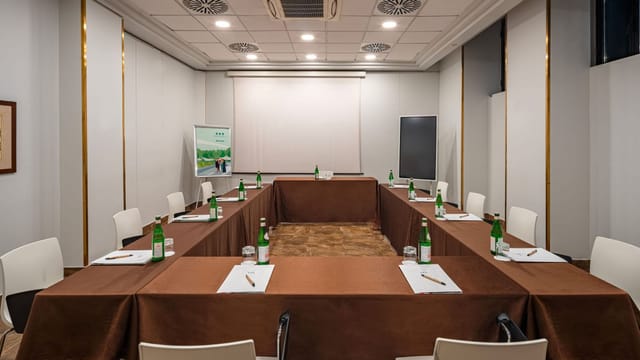 Function room at UNAHOTELS Galles Milano, U-shaped setup for professional events.